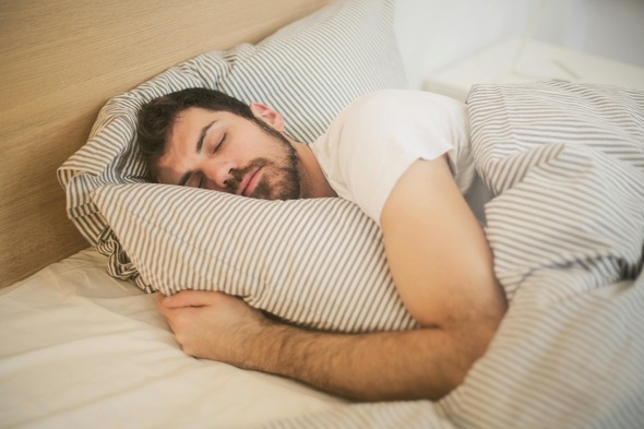 Man in a white shirt sleeping