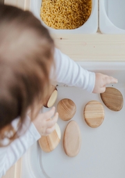 https://www.pexels.com/photo/crop-anonymous-child-getting-brown-stones-from-white-container-at-home-3933101/