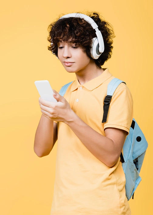 A boy is listening to an audiobook on on Audible.