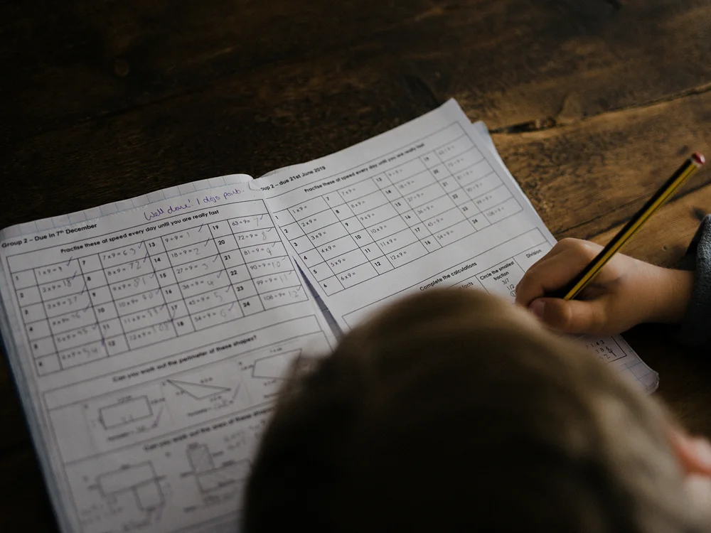 A middle school student doing math homework.