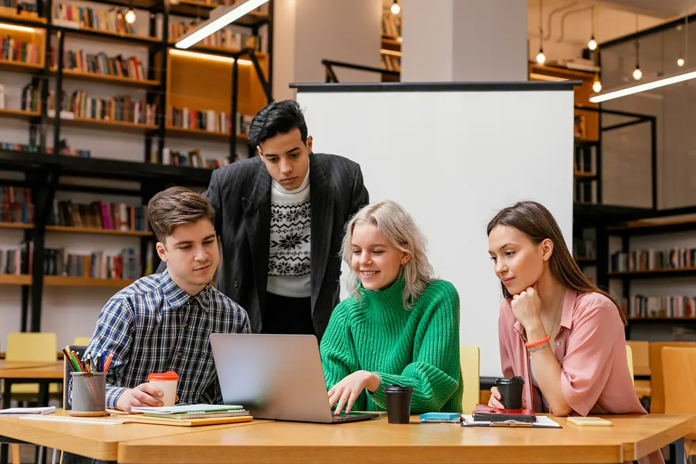 A group of students working together in a school library.