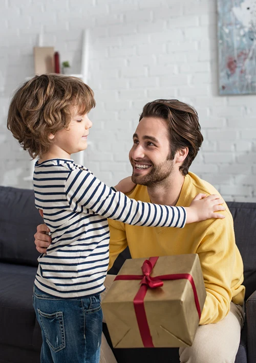 Dad receives a gift from his son.
