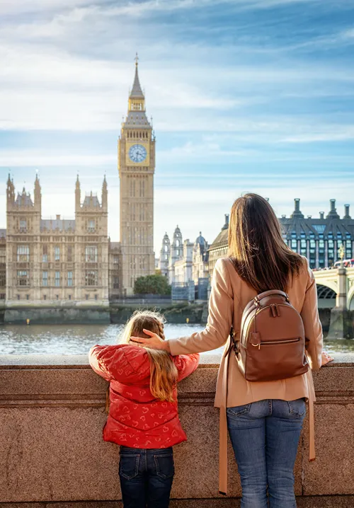 Mother and daughter looking at Big Ben across the water.