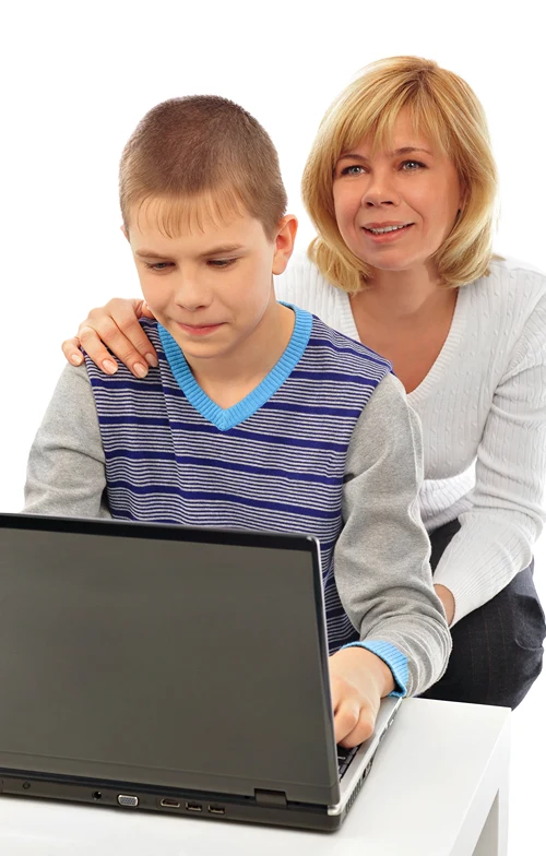 Son's online therapy as mom sits behind him.