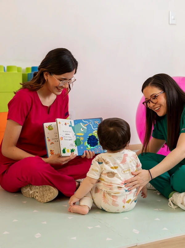 Child being read to in early child development clinic.