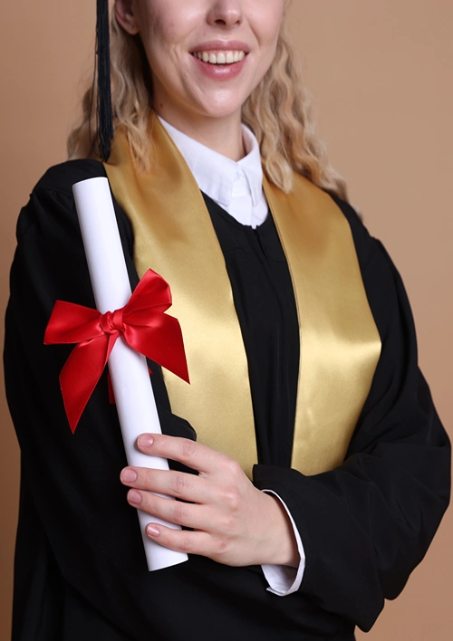 Close of stole worn by female grad student dressed in graduation attire.