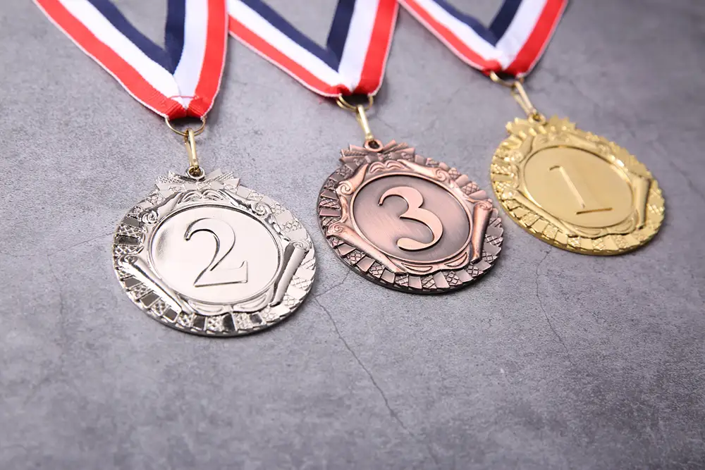 First, second, and third place medals.