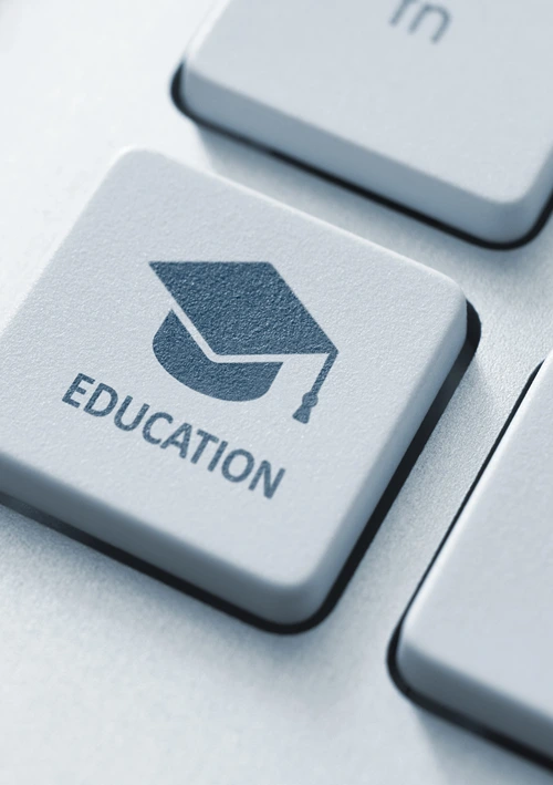 A computer keyboard with an Education symbol.
