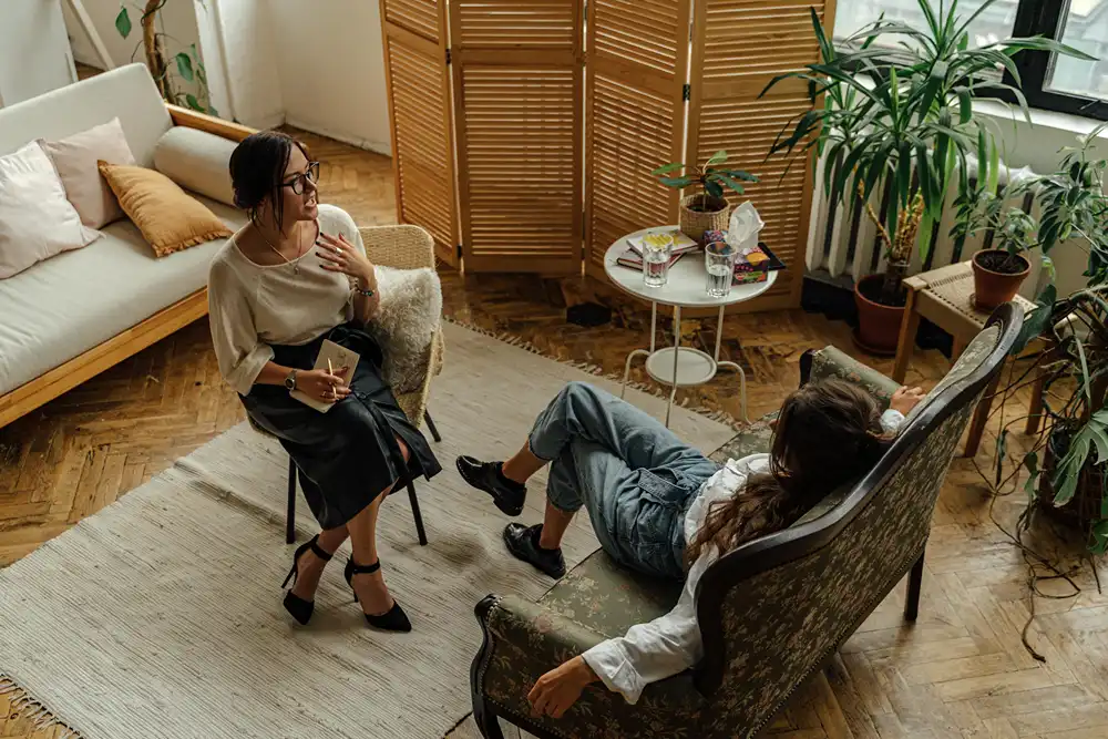 A female therapist is counselling a woman.