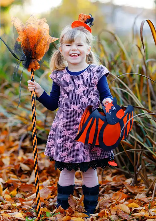 A toddler dressed up for Halloween.
