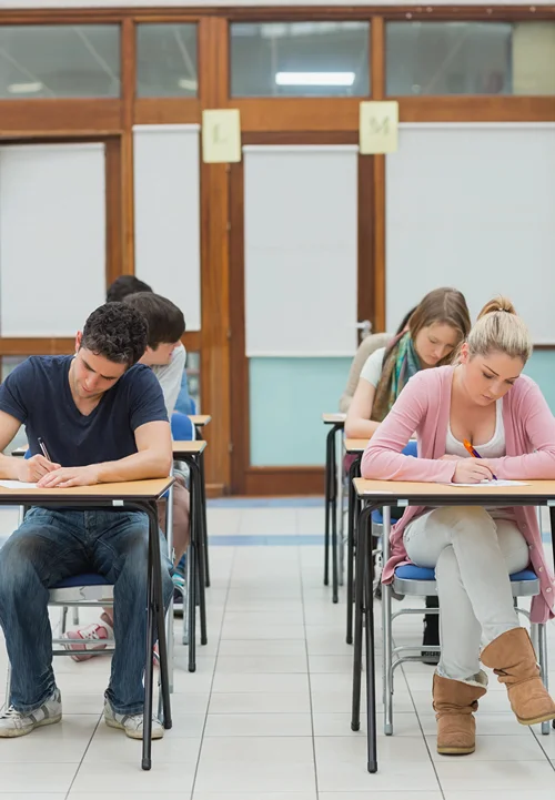 College students writing an exam.