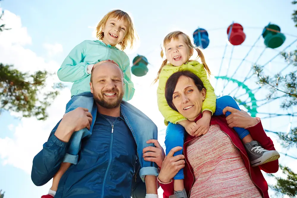 Family having fun at an amusement park.