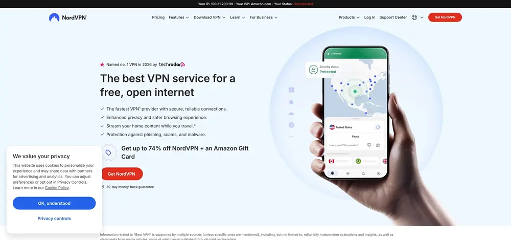 NordVPN home page shows hand holding smartphone with U.S. map on screen.