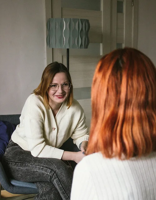 A female school counsellor in a session with a female student.