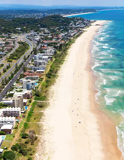 An ariel view of the Australia's Gold Coast where city meets sand meets water.